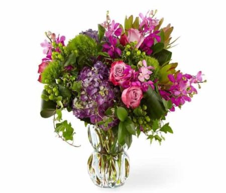 Our Divine Garden bouquet is a luxurious display of hydrangea, roses, orchids and lush greenery presented in a gorgeous heavyweight molded glass vase, it's a true show-stopper.